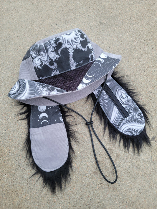 Void Fractal Bunny Bucket - Nothing is as it Seams
handmade gray and black monochrome psychedelic bunny bucket hat with long ears that have pockets, featuring upcycled materials